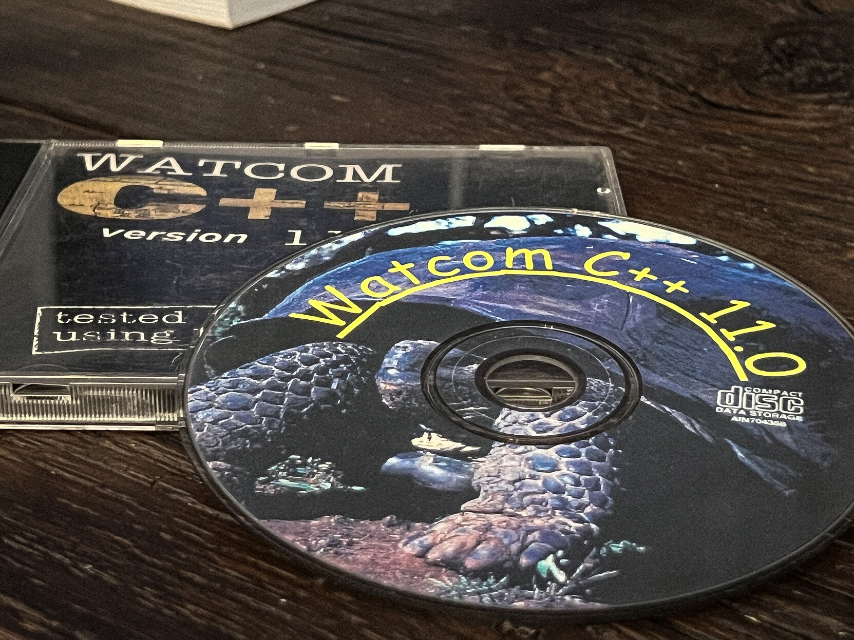 A photo of CD case and a disk with Watcom C++ 11